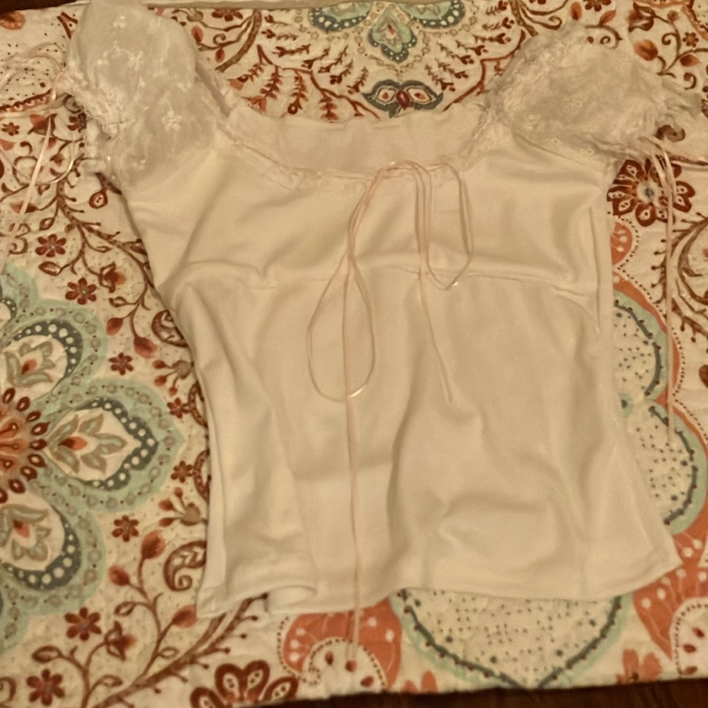Nice stretchy white shirt with coquette ribbons and adorable ruffle sleeves